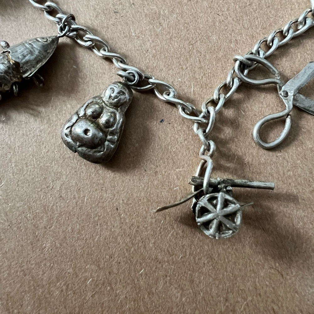 Asian inspired Silver Charm Bracelet.